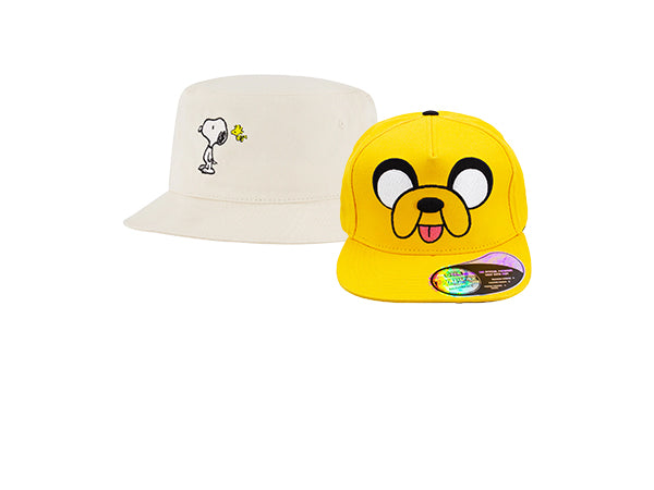 Two hats, one beige with a small design and one yellow with a cartoon character, on a white background.